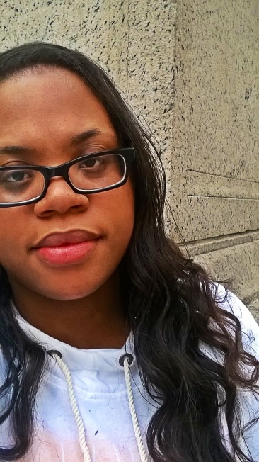 Sanaa Brooks sitting on NYPL steps after Real Simple Magazine's Beauty and Balance Event